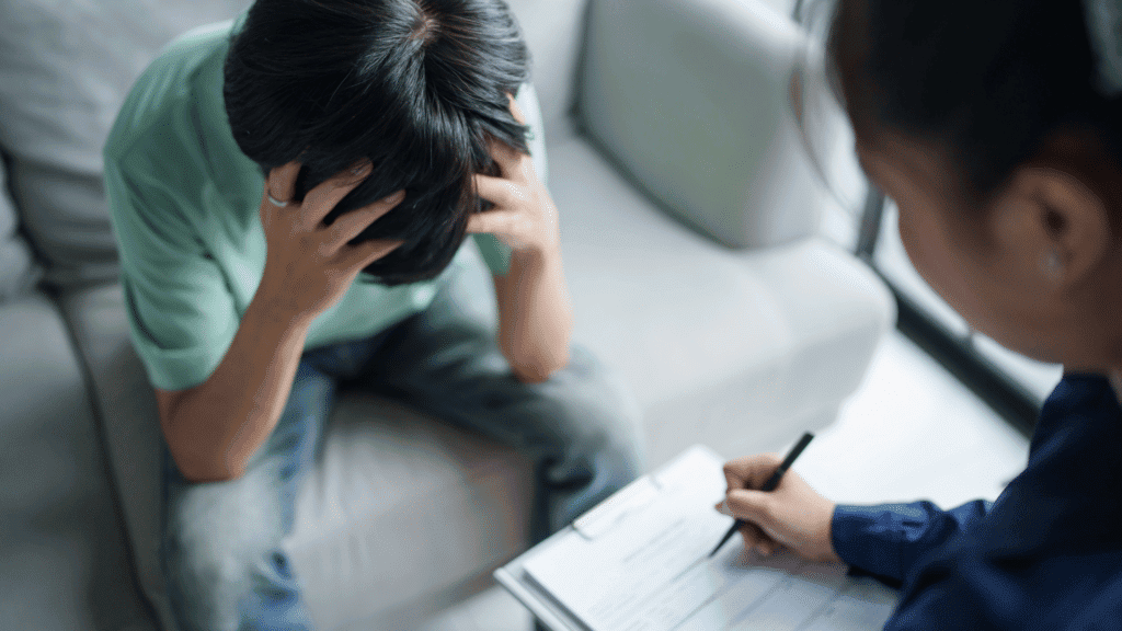 Person distressed during a counseling session at Destiny Recovery Center.