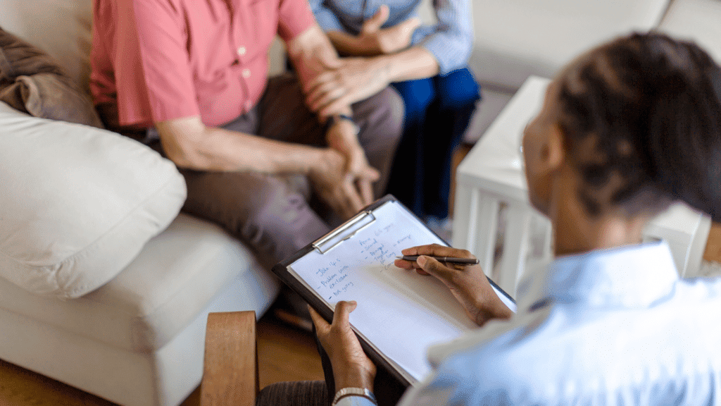Therapist and patient discussing mental health in a counseling session.